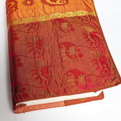 Decorative notebook with intricate patterns on a white background