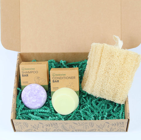 eco gift box with sustainable products with shampoo and conditioner bar and loofah sponge