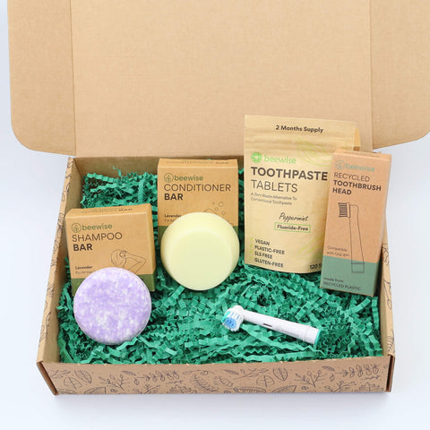 eco gift box with sustainable products with shampoo bar toothpaste tablets and electric toothbrush head