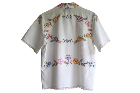 Handmade shirt button up, with flower embroidery from a sustainable fashion brand. Made from recycled materials. 