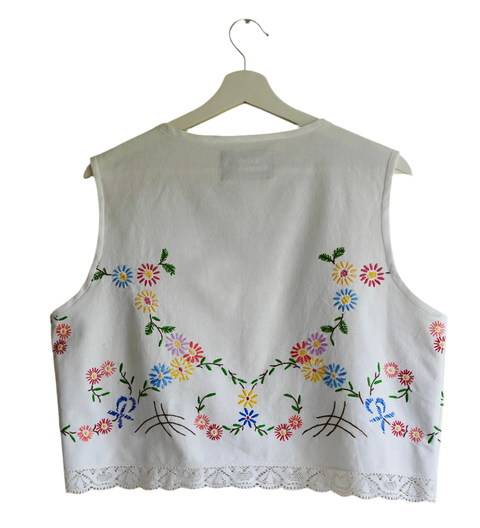 Handmade vest, with flower embroidery from a sustainable fashion brand. Made from recycled materials.