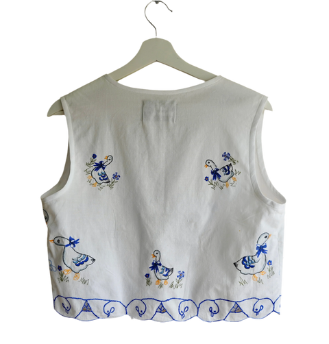 Handmade vest, with duck embroidery from a sustainable fashion brand. Made from recycled tablecloth materials.