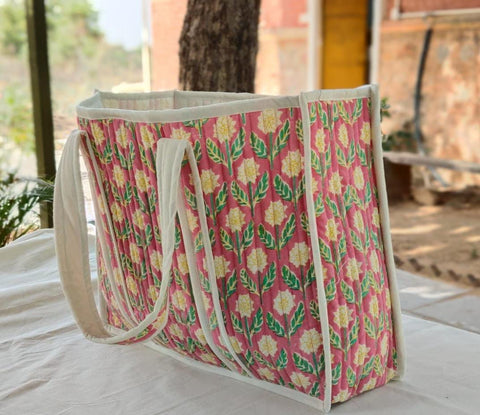 Large quilted weekend tote bag, vibrant pink block print, floral design