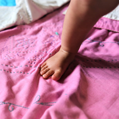 Embroidered, 100% cotton kantha baby blanket in pink and red elephant design by Khushi Kantha