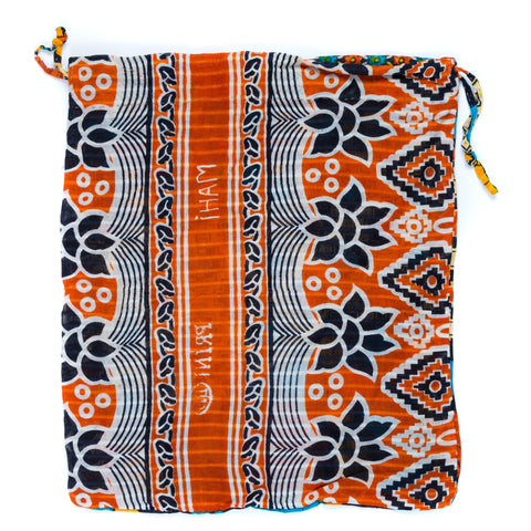 Decorative bag with orange, blue, and white patterns on a white background