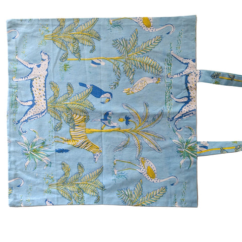 Fabric bag with animal and plant pattern on a beige background