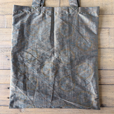 metallic sari tote bag on wooden background