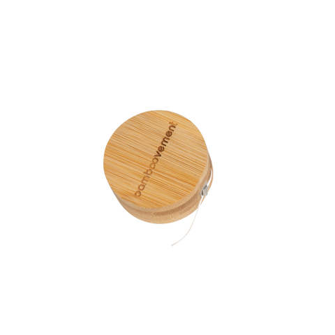 Dental floss in bamboo packaging