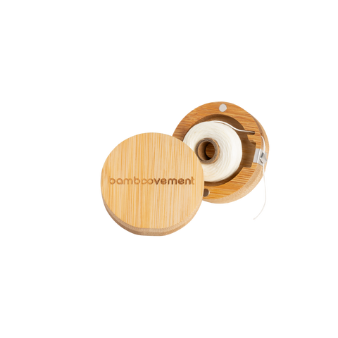 Dental floss in bamboo packaging