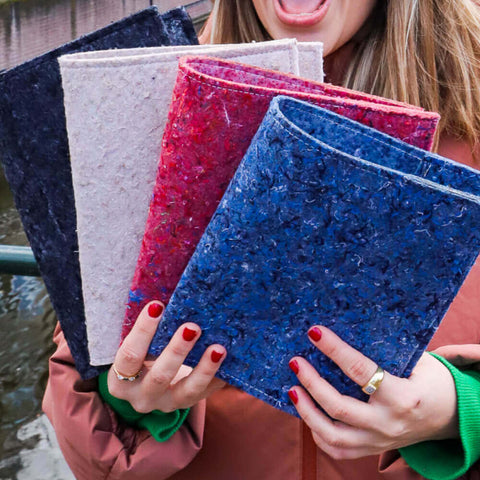 four-different-colored-sustainable-notebooks-sleeves