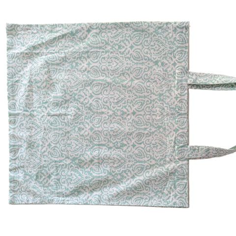 Patterned tote bag on a beige background