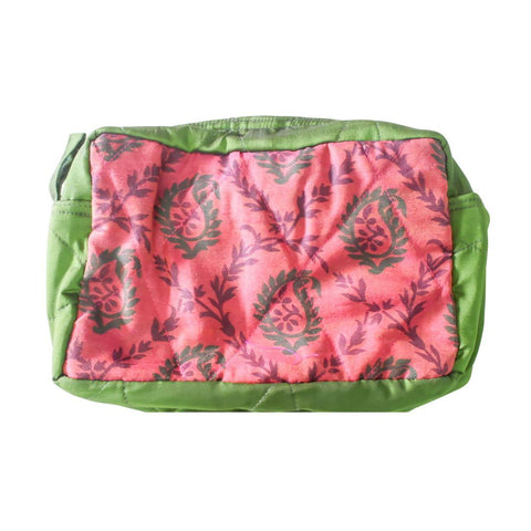 Pink pouch with green leaf pattern and green border on a white background