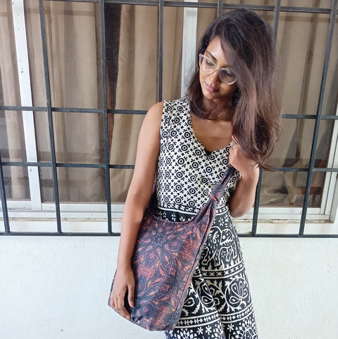 Vibrant crossbody sling handbag with knotted strap