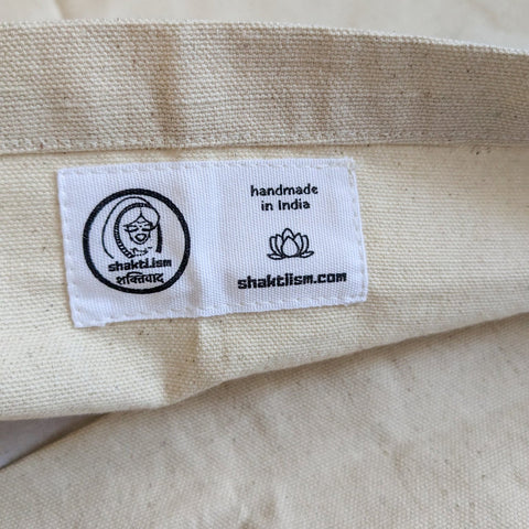 Label inside the cotton flat of sari patchwork cushion cover close up