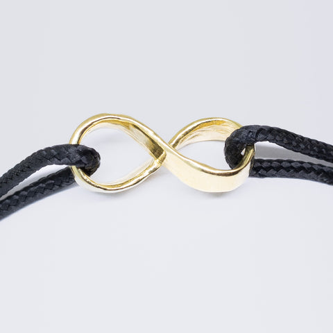 Infinity armband - verguld goud - zwart