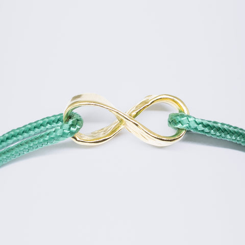 Infinity armband - verguld goud - groen