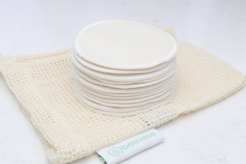 Reusable Makeup Remover Pads made of organic cotton showing on top of the mesh bag