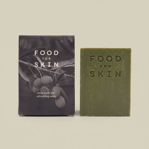 Olive Body bar met zwart wit verpakking op lichte achtergrond