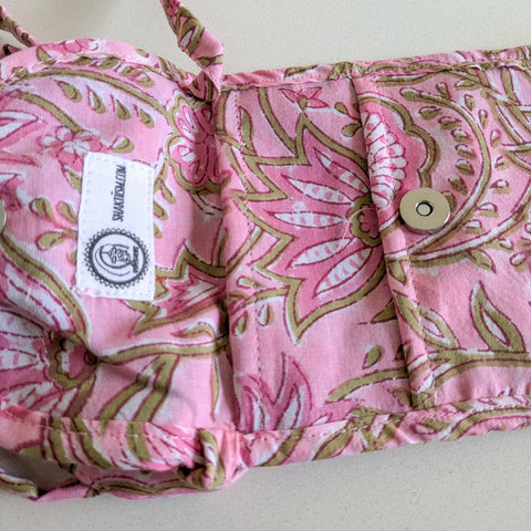 close up view of pink mobile purse interior