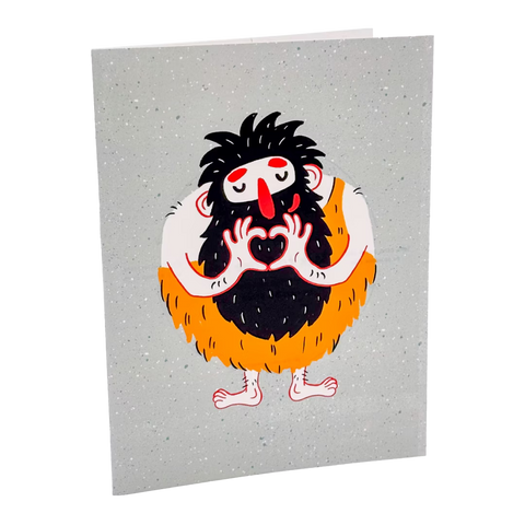 Reusable card with a cartoon caveman holding hearts on a gray background