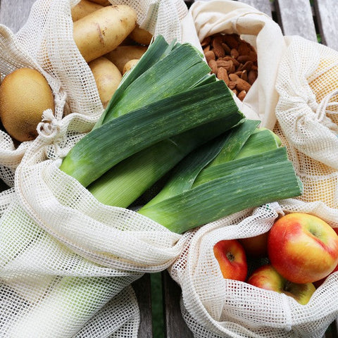 reusable produce bags mesh and bread bags made in 100% organic cotton shown with vegetables and fruits inside