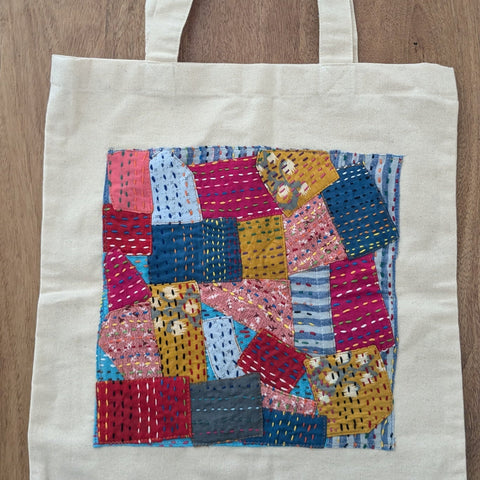 Square design sari patchwork cotton tote bag against wooden background
