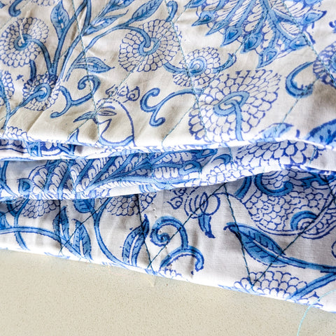 white blue block printed quilted pouch close up